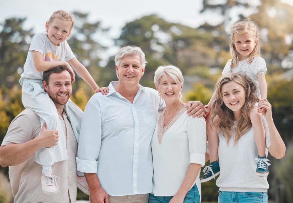 Smiling, multi-generational family.